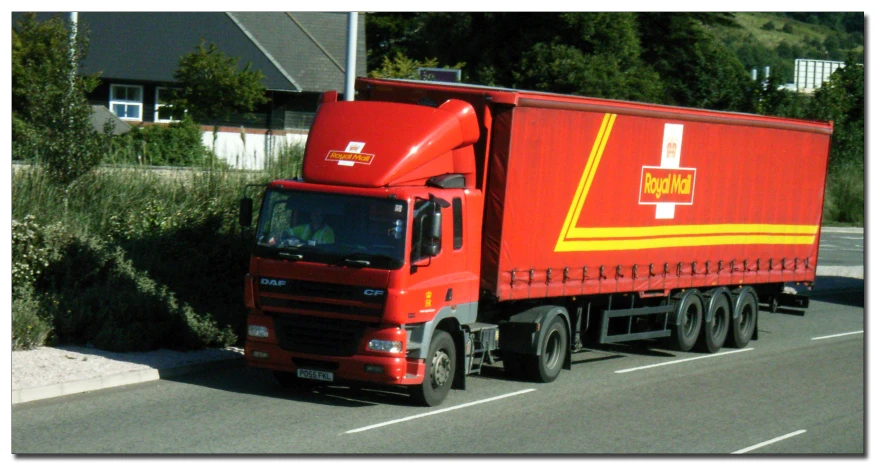 a truck is driving down the road, and has an inverted tail