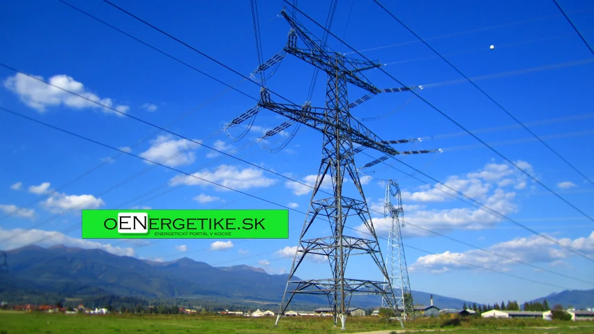 large power tower next to a road and grass