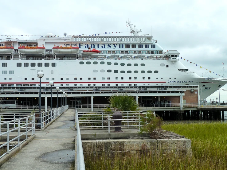 there are two large ships docked at the dock