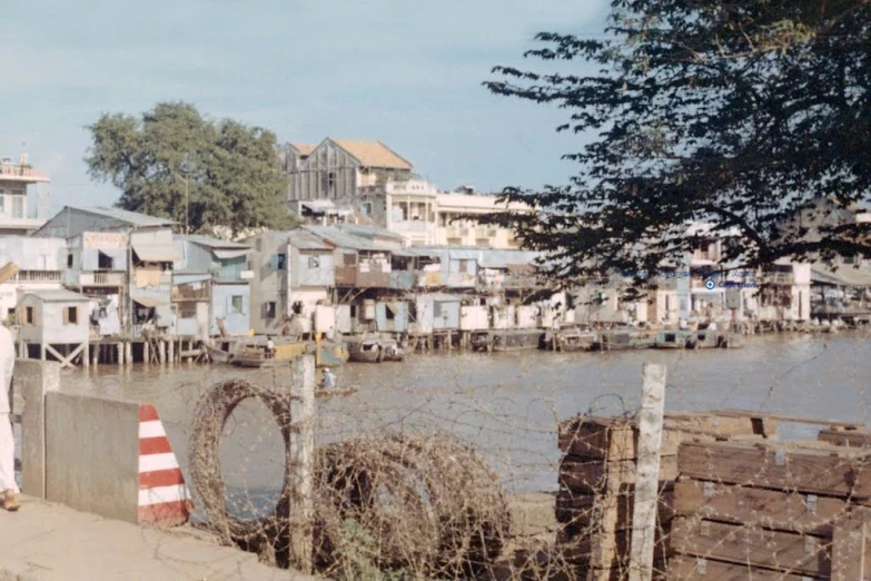 some buildings on a shore by the water