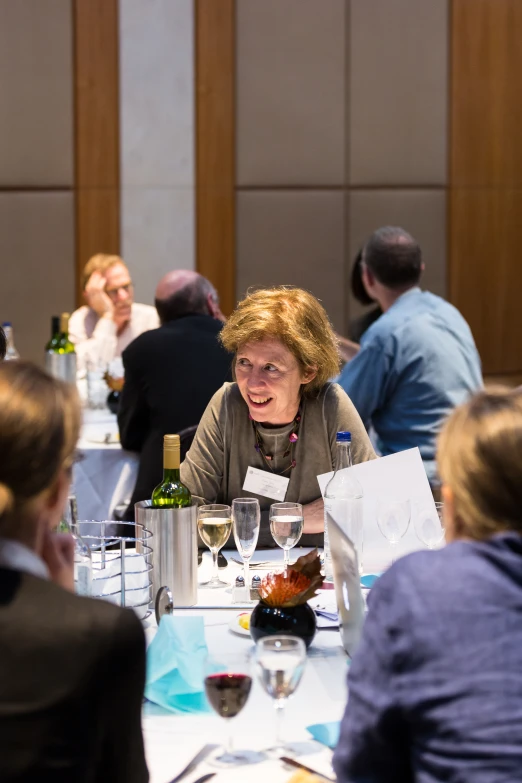 a group of people gathered around a dinner table