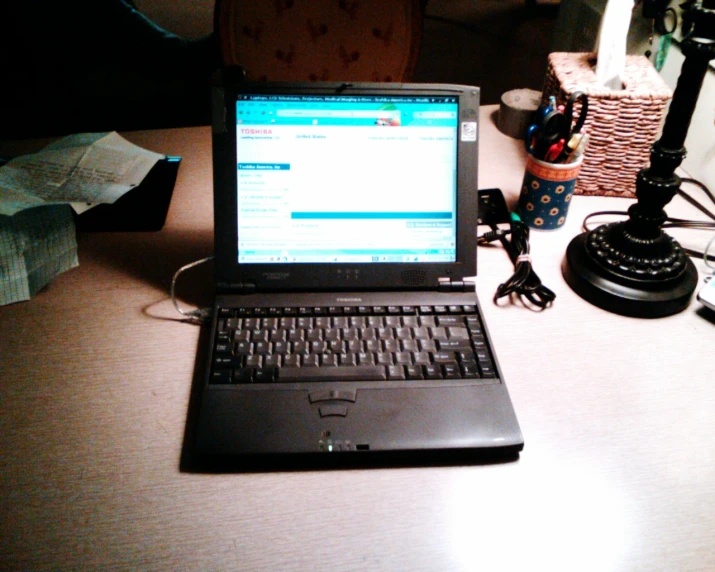 an open laptop computer sitting on a desk