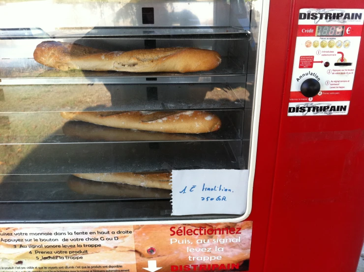 the bread is cooling on the rack in a food store