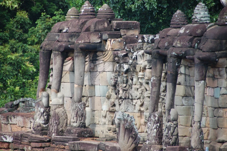 an ancient sculpture with lots of carvings on it