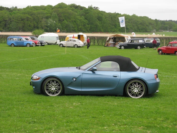 many old model cars parked next to each other