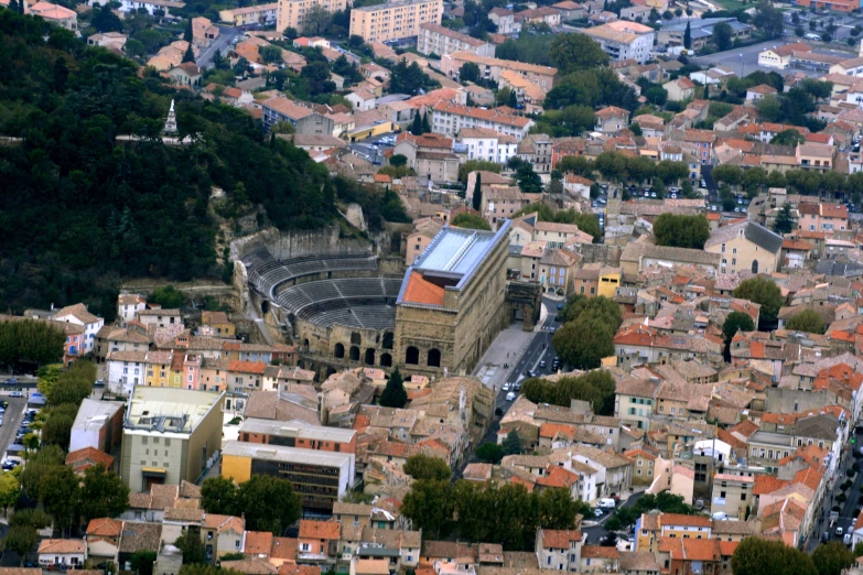 aerial po of a town with old roman amphit