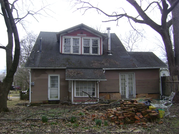 the house is brown with a black roof