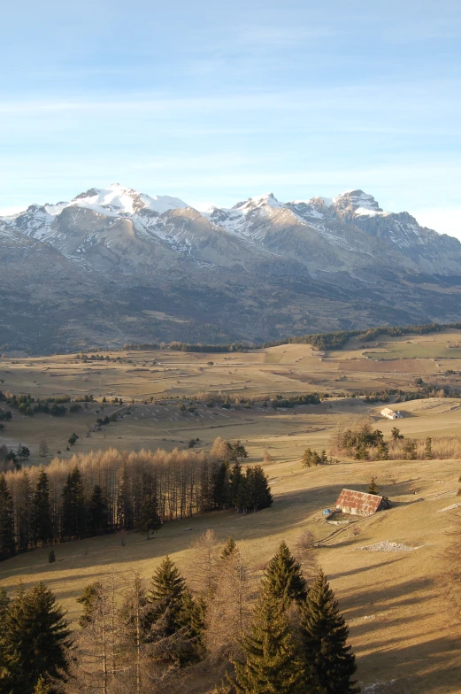 a scenic landscape with mountains in the background