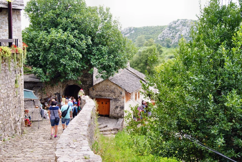 a group of people standing in front of a tunnel