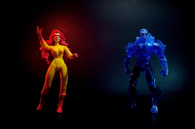 two figurines made from neon lighting in their form - fitting outfits