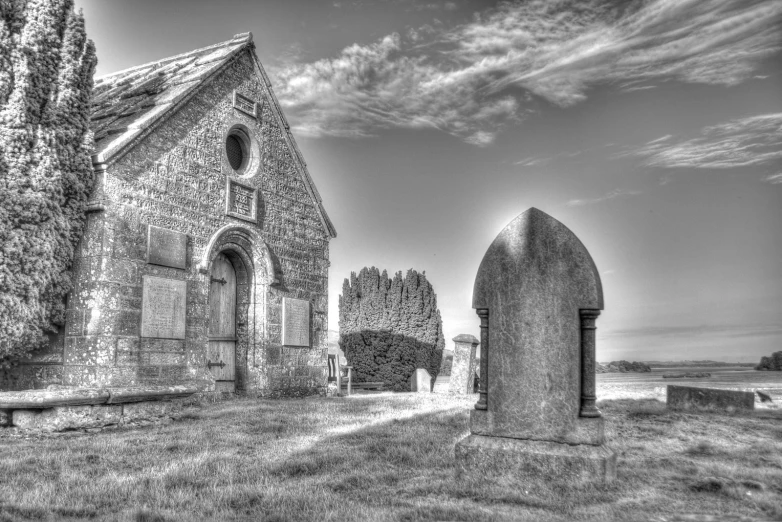 a church in front of a graveyard is shown