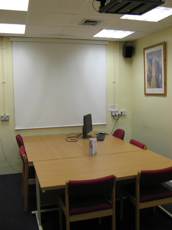 a large conference room has tables and chairs