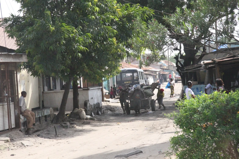 a few people are walking near a truck on the street