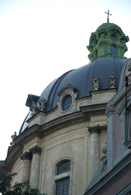 a large building with a cross on top