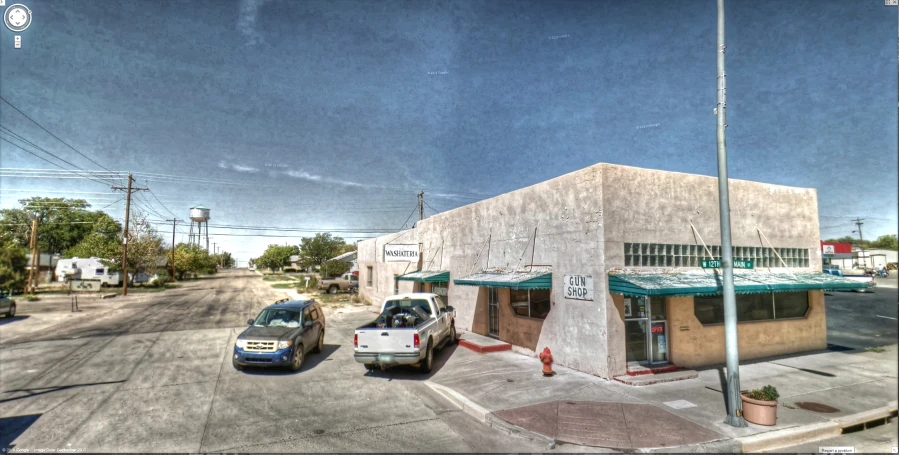 a small business is on a corner corner in the desert