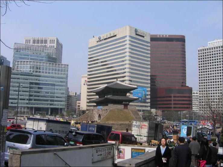 a group of people walk around the city