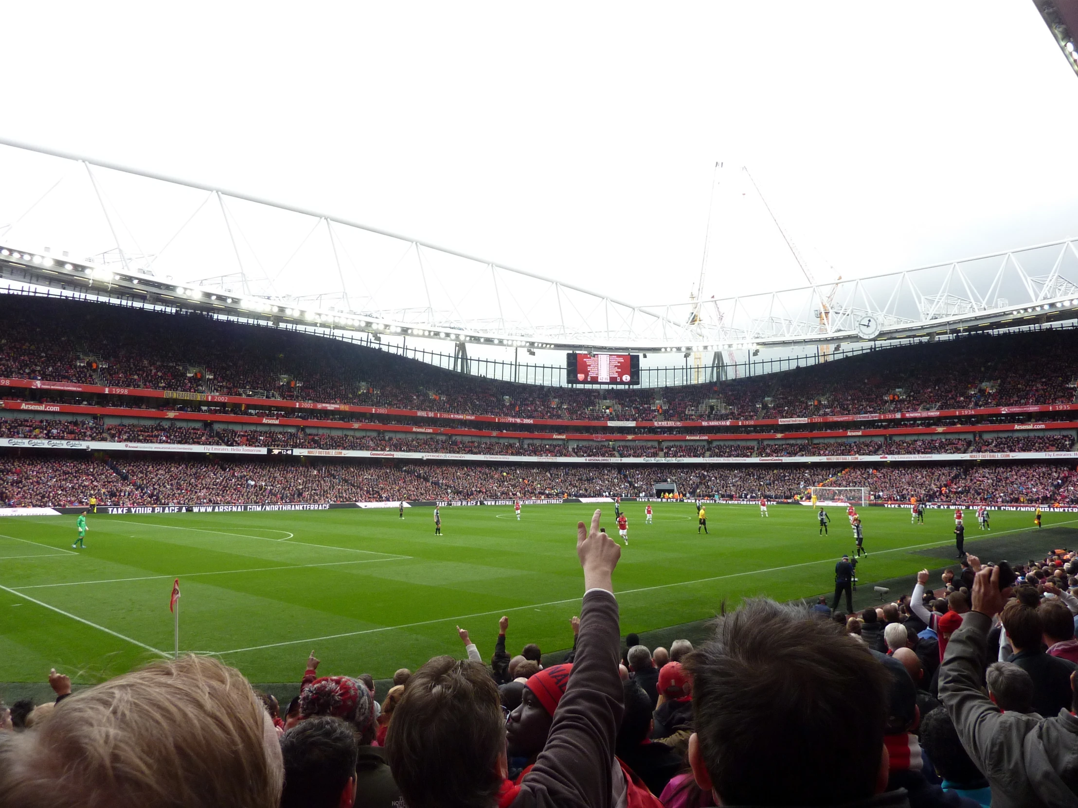 a person taking a picture of a soccer match