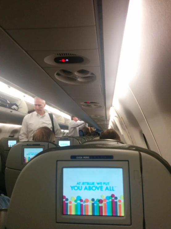 the inside of an airplane with electronic screens