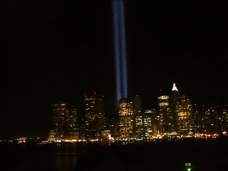 the lights of the planes streak across the sky over a city