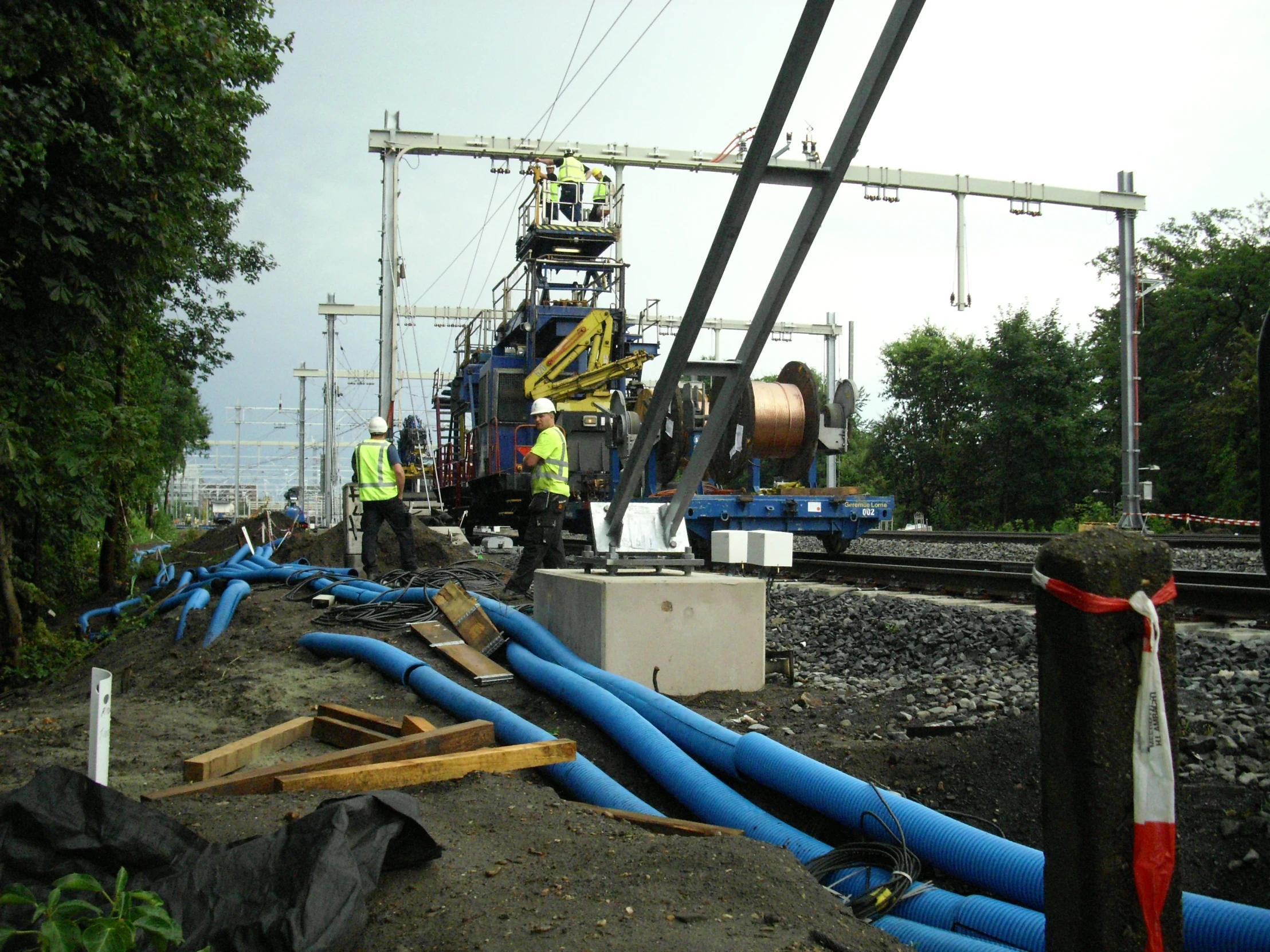 there is a crew working to repair the train tracks