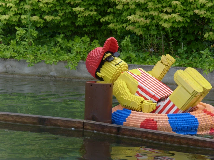 there are a large lego sculpture out on the water