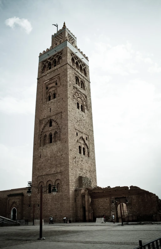 an old tower that has a cross on top