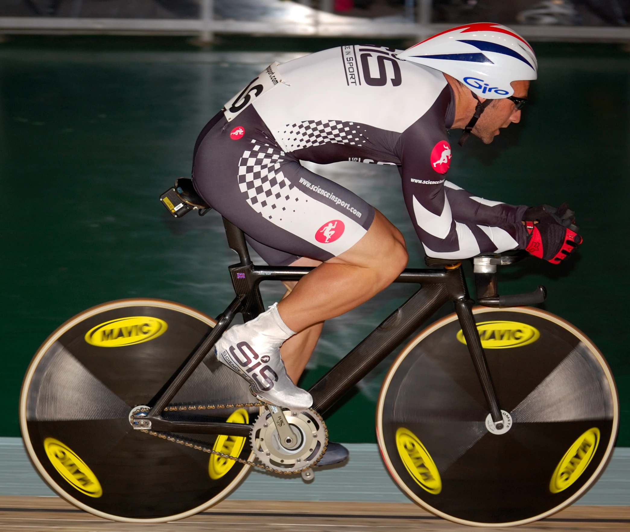 a man riding a bike with an extra bib