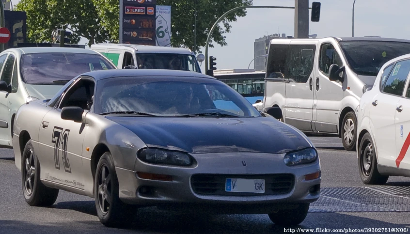 there are cars on the street on the road