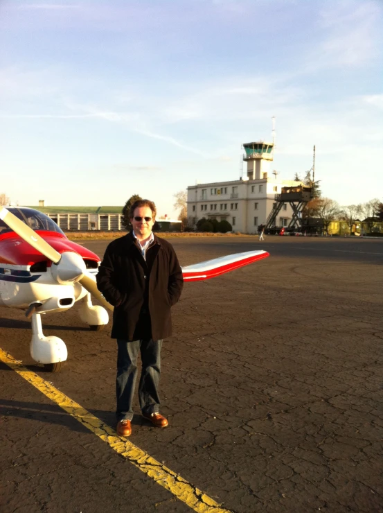 the man standing in front of his model airplane