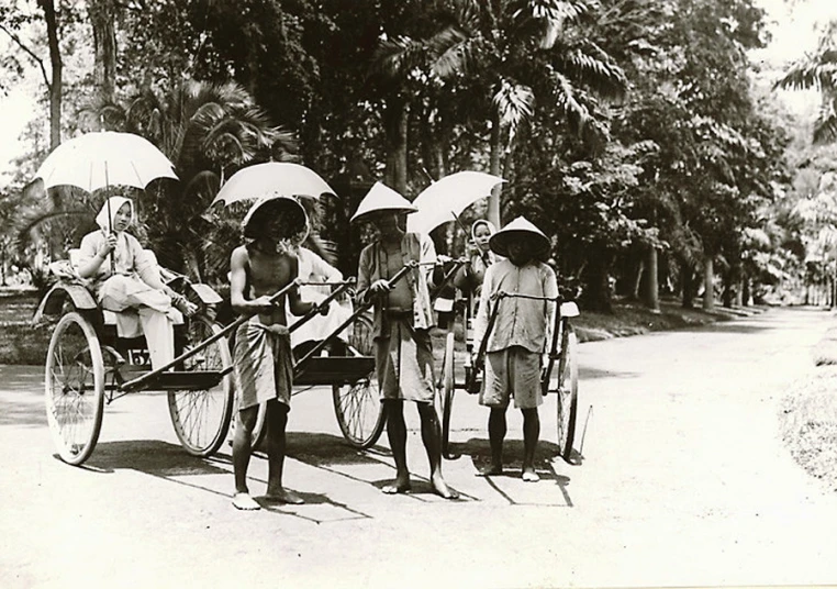 people on a horse drawn carriage in an old po