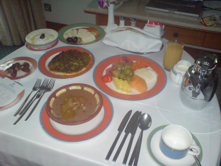 an image of a table with plates of food on it