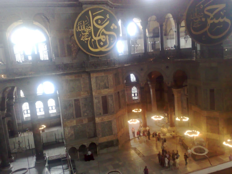 an illuminated dome in a large stone building