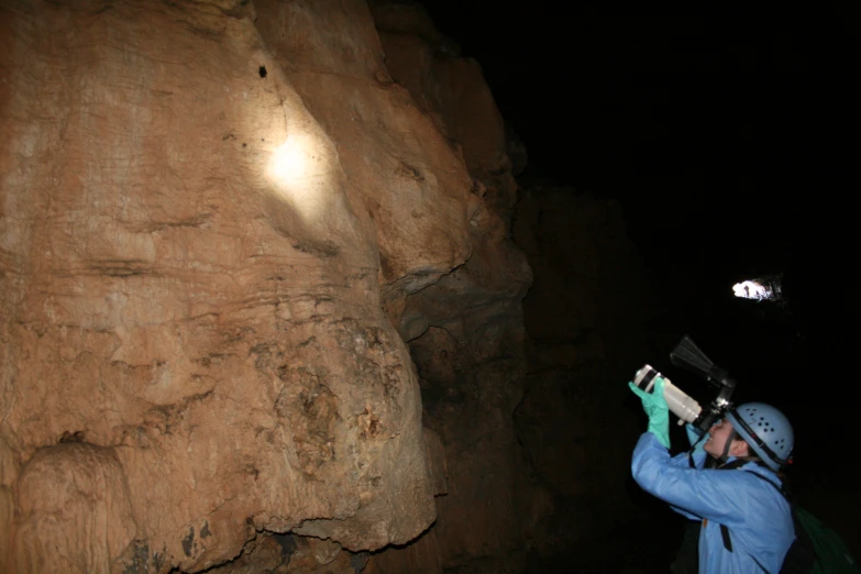 the man is carrying an object to look at soing in his hand