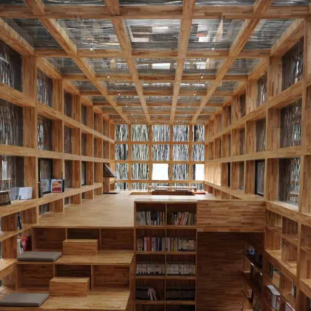 there is a large room with shelves and books