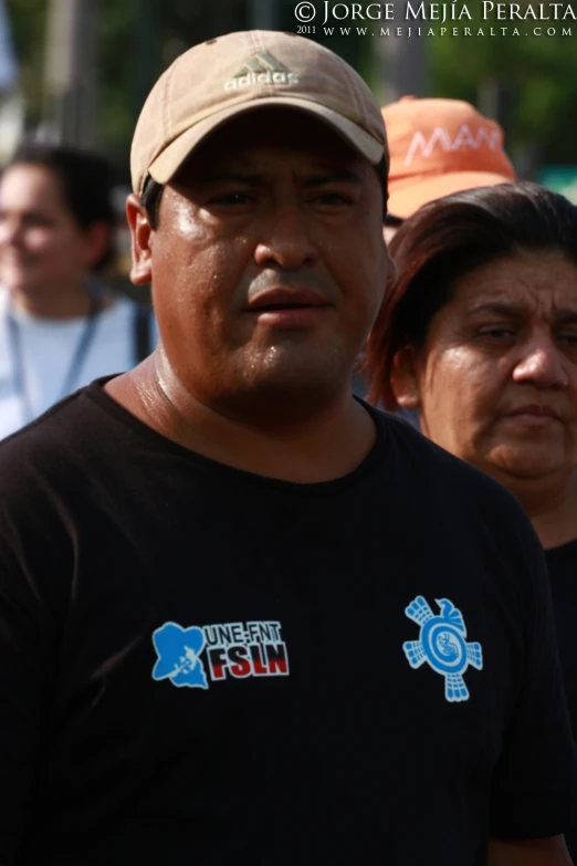 a man standing in front of a group of women in a line