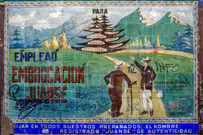 two men looking at a sign on the side of a building