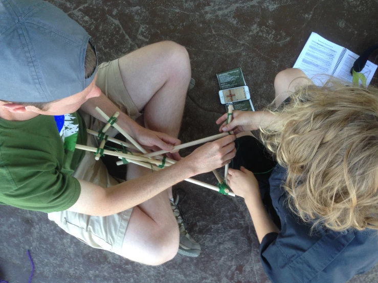 some people are building sticks together in order to make things