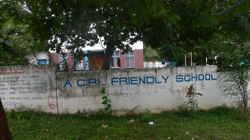 a white wall with words in blue on it