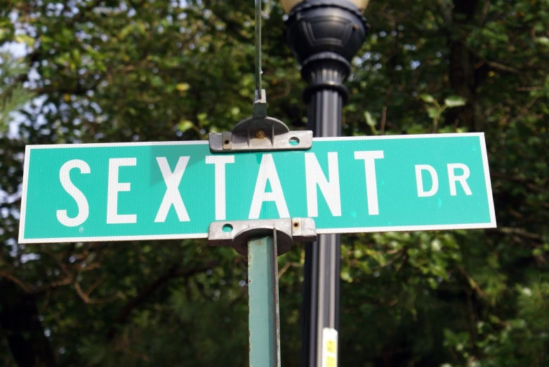 an image of a street sign that says sextant drive