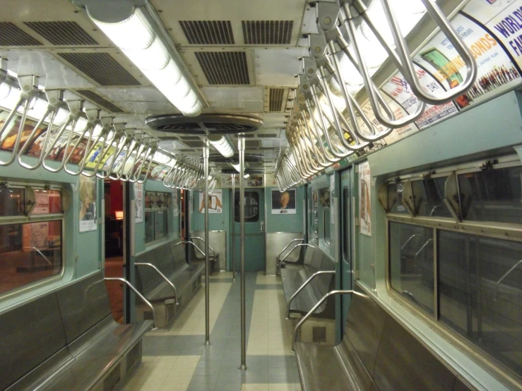 subway train carriage with open doors and empty benches