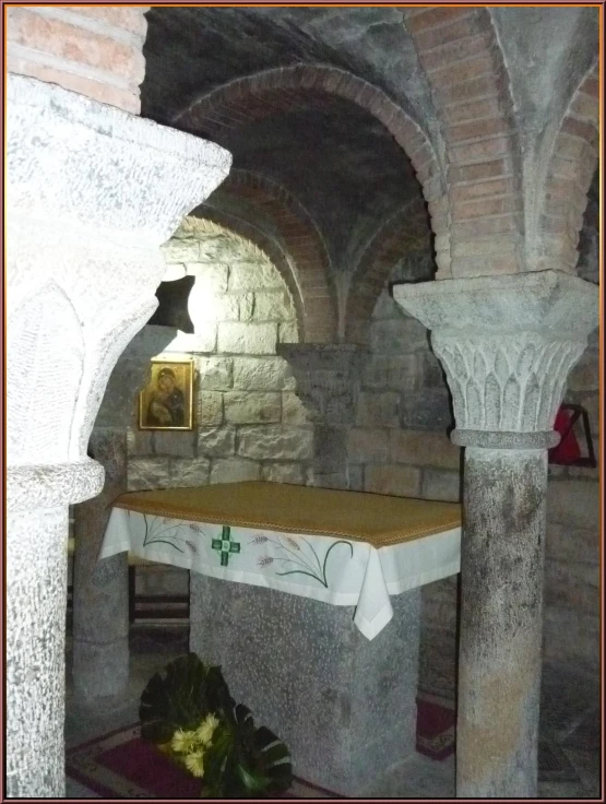 a table with white cloth on it in a room