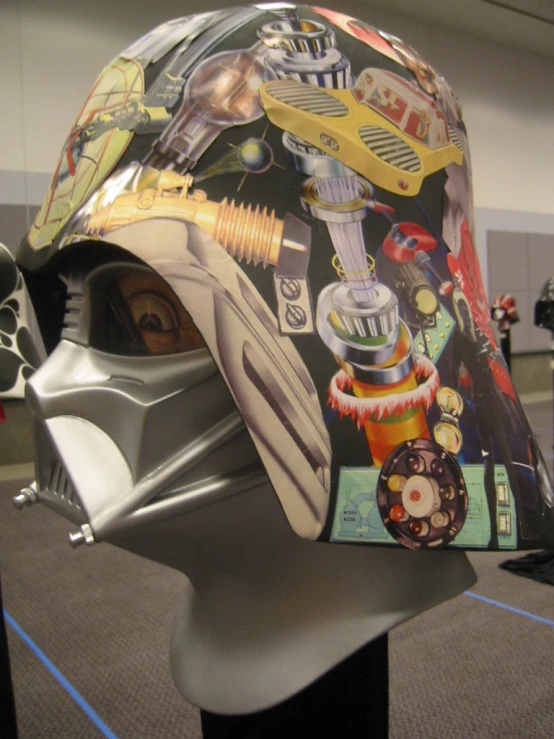 a person's helmet that has various pictures on it