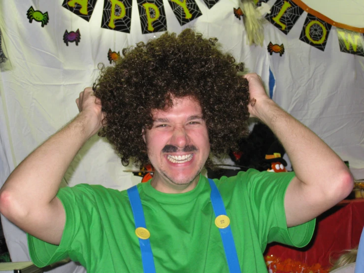 a person with an afro and a happy birthday banner