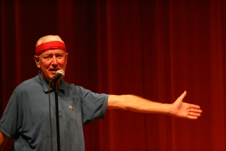 a man giving a speech at an event