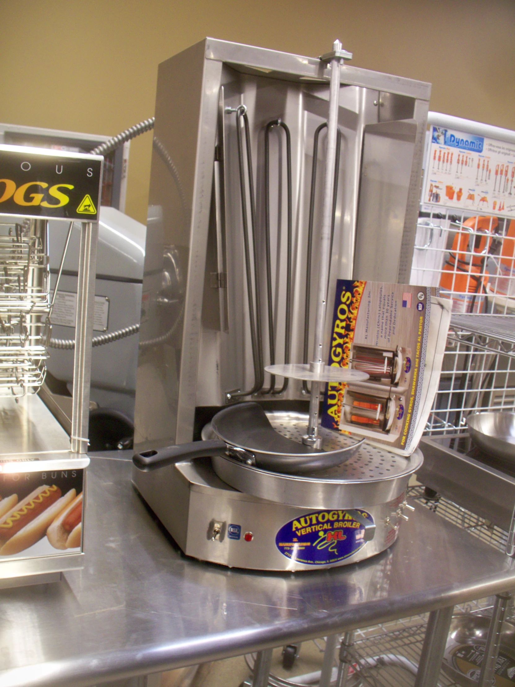 a counter with a silver metal machine next to some packaged foods
