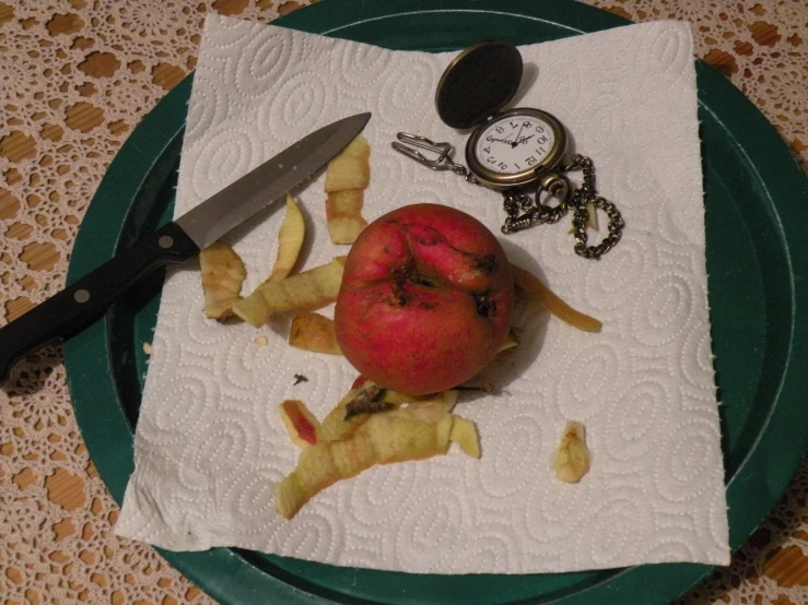 apples and cut up fruit sitting on a napkin