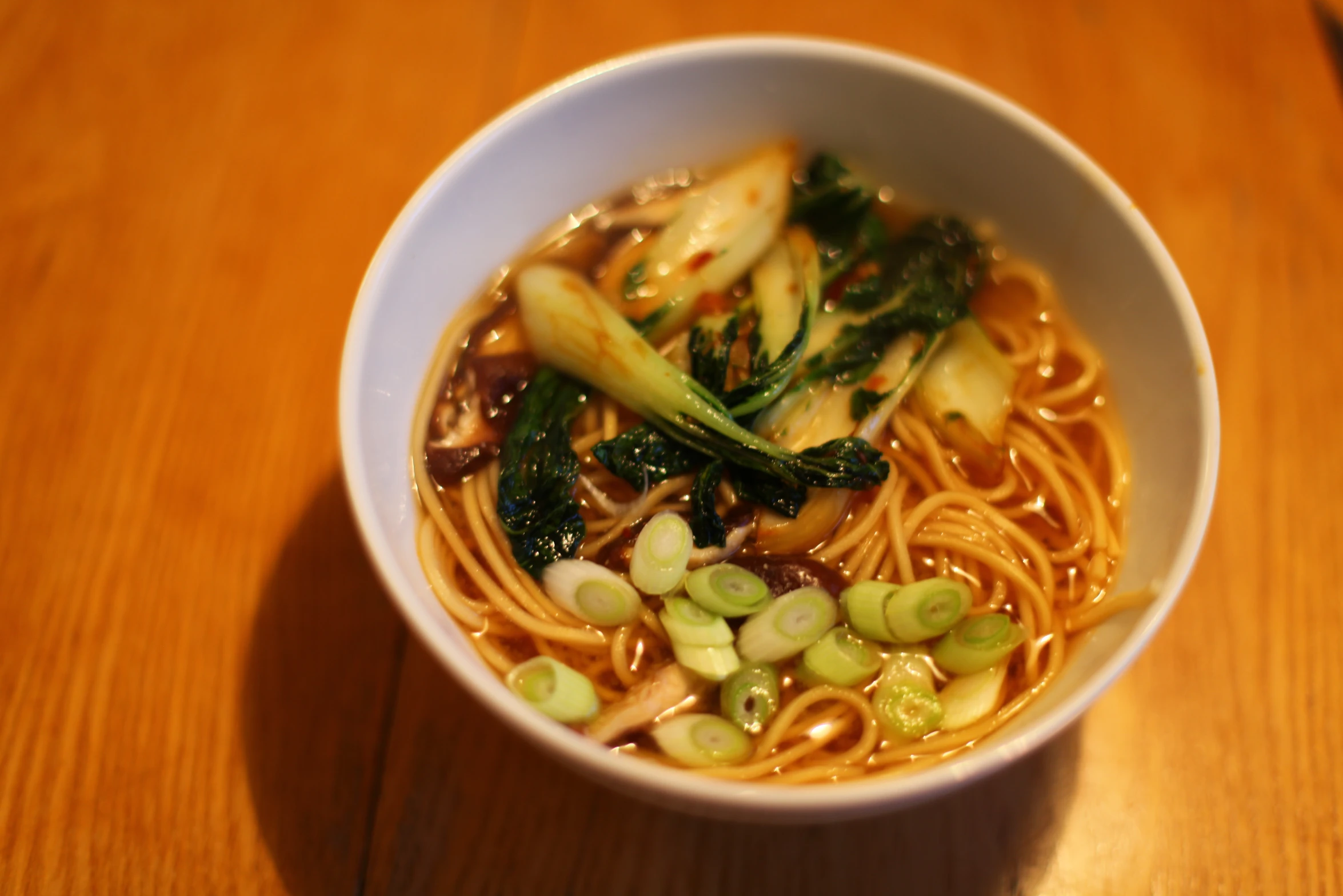 a bowl filled with noodles and vegetable soup