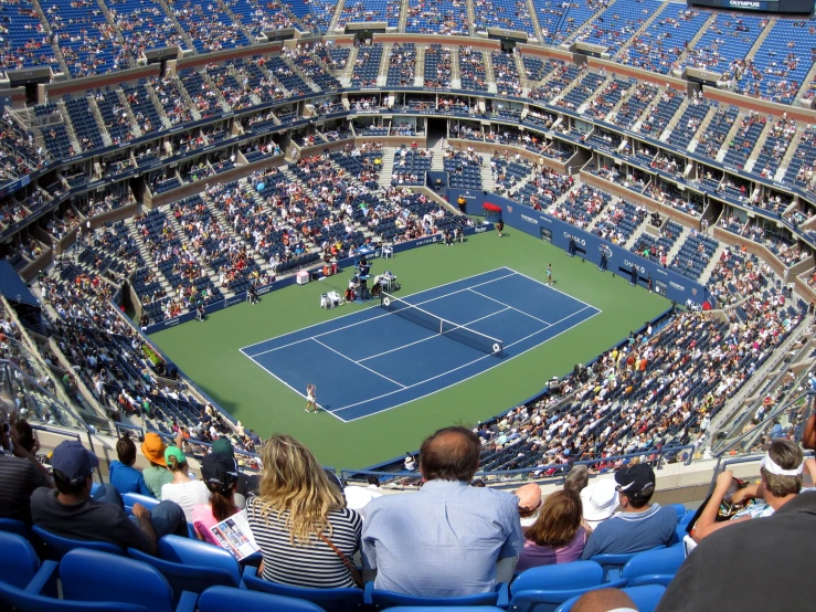 a tennis match in progress at a stadium