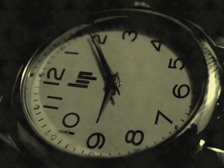 a clock is displayed on the counter of a store