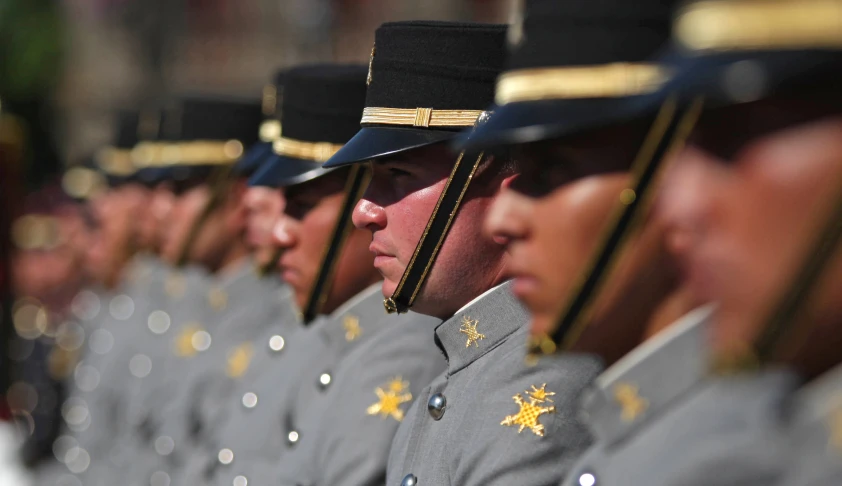 a military band is lined up with their hats down